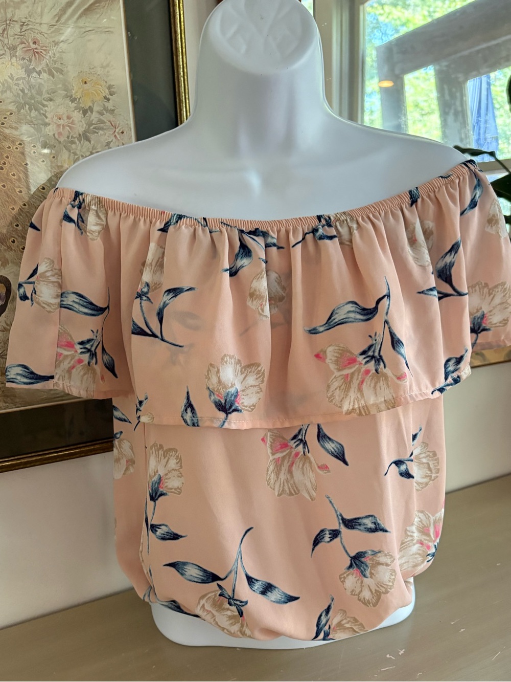 Soft pink floral blouson top featuring a romantic, off-the-shoulder